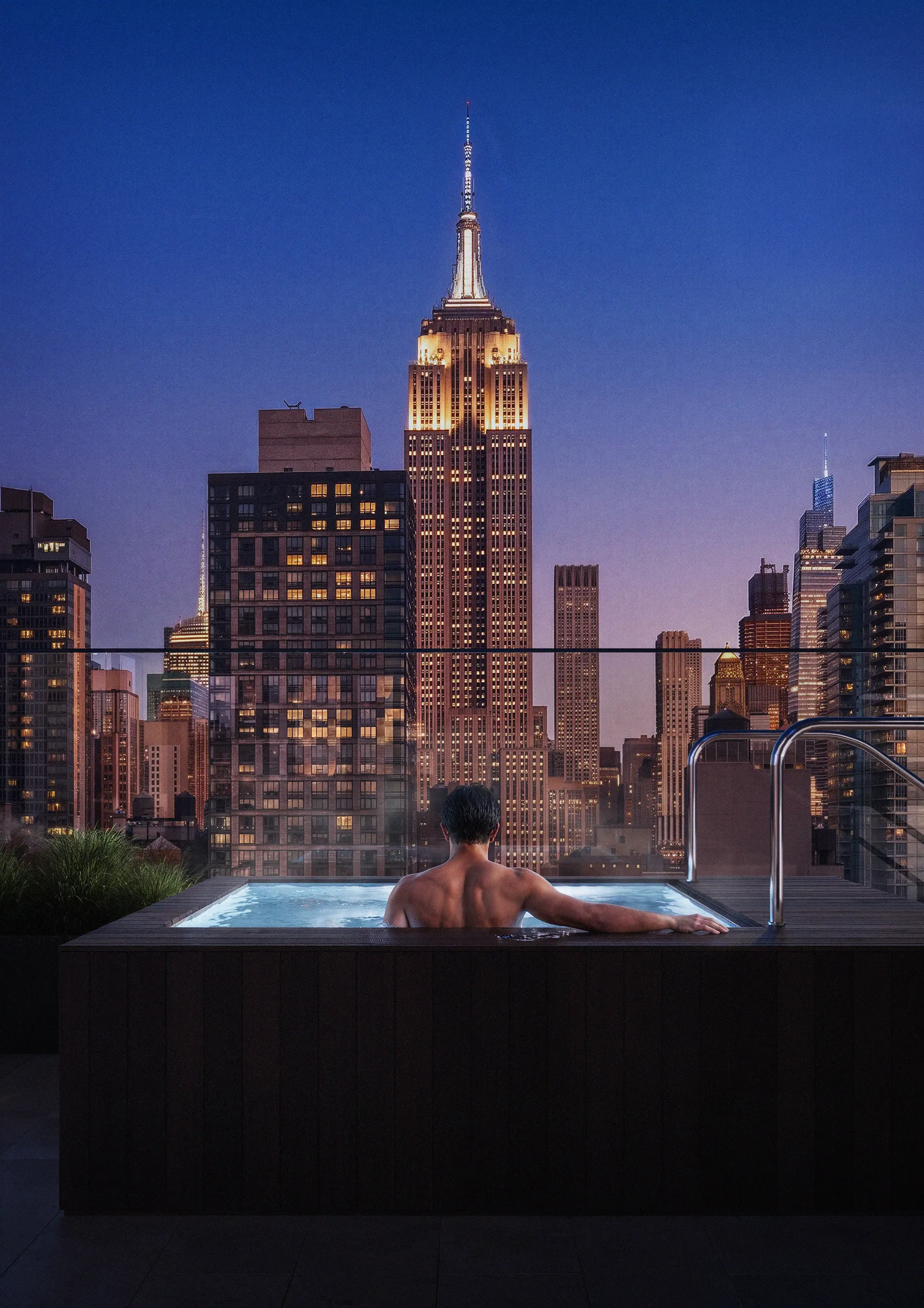 Arrival, the terrace after dark, the skyline standing in for the address